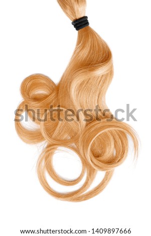 Curly golden blond hair isolated on white background. Circle shaped Royalty-Free Stock Photo #1409897666