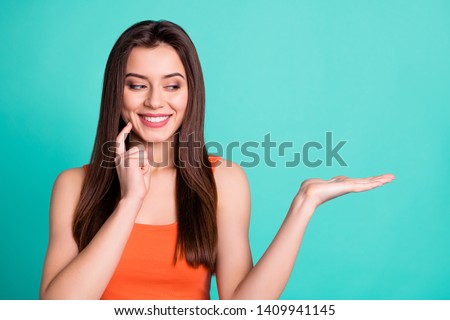 Portrait attractive pretty person promotion attention thoughtful thoughts dream option inspired positive cheerful satisfied content fashionable spring orange long outfit isolated teal background