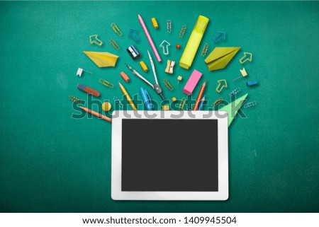 School notebook and stationery over school desk. Back to school concept