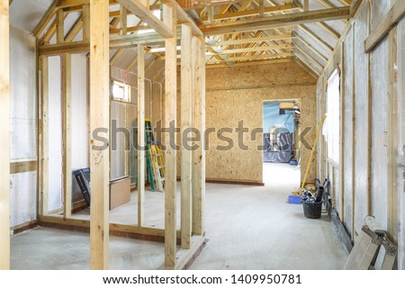 Interior of a UK timber frame house under construction Royalty-Free Stock Photo #1409950781