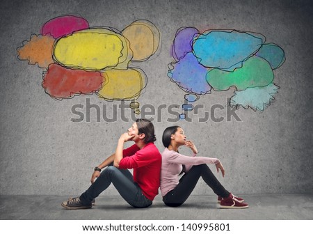 couple sitting on the floor thinking