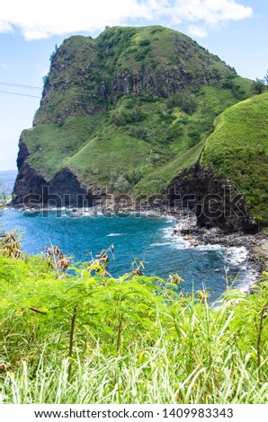 Honokohau maui mountain ocean landscape green grass blue water brown rocks