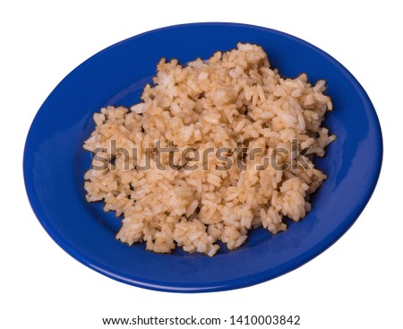  rice in soy sauce isolated on white background. rice in soy sauce on a blue plate top side view .
