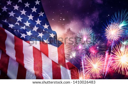 American flag and fireworks with night sky background. 