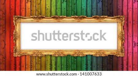 long old golden frame over colorful wooden wall. beautiful vintage background with empty space for your picture or text
