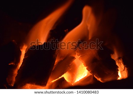 The flame burns the charcoal in the stove causing heat and lighting.