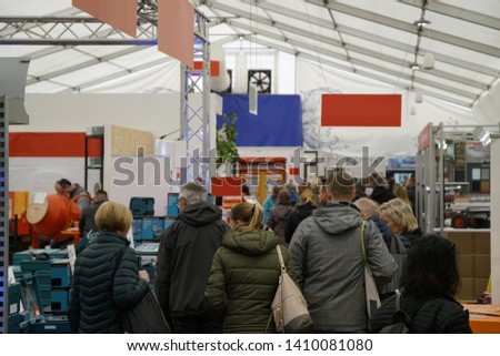 trade fair with different booths Royalty-Free Stock Photo #1410081080