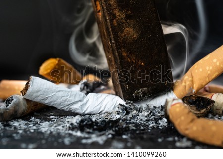Smoke cigarettes were smashed, destroyed by an iron hammer.Smoking stop concept Eliminate smoking.The World No Tobacco Day falls on May 31 of every year.vintage tone.