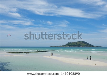 shoaling beach and island against blue sky, Jeju olle route14 Royalty-Free Stock Photo #1410108890