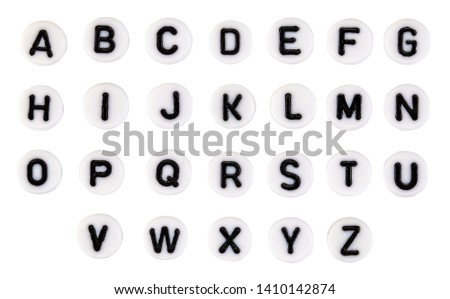 Plastic beads alphabet isolated on a white background.
