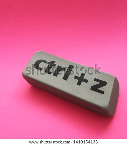 eraser with the inscription "ctrl + z" on a pink background