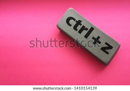 eraser with the inscription "ctrl + z" on a pink background