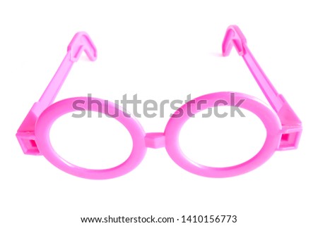 Toy of pink plastic glasses for children isolated on white background.