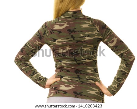 Close up of unrecognizable woman wearing moro camo military camouflage top, detail of pattern.