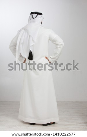 Back view of an Emarati man. Royalty-Free Stock Photo #1410222677