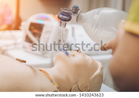 medical  students are learning how to rescue the patients in emergency. CPR training with CPR doll and Ambu Bag Royalty-Free Stock Photo #1410243623