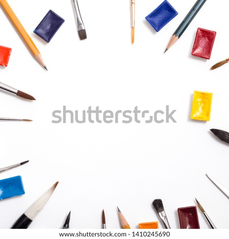 Background with white paper, pencils and eraser. Workplace for the painter. Background to display the logo and lettering. copyspace, space for text. the blogger instrument.