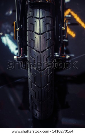 Black motorcycle tire.Front wheel of modern motorcycle.