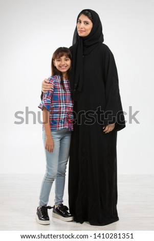 Portrait of an Arab mother and her daughter. Royalty-Free Stock Photo #1410281351