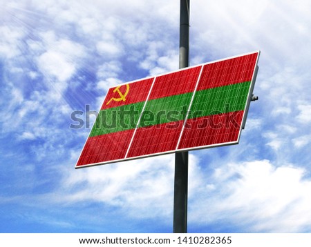 Solar panels against a blue sky with a picture of the flag of Transnistria