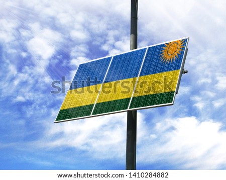 Solar panels against a blue sky with a picture of the flag of Rwanda