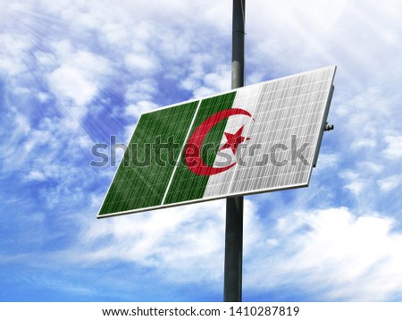 Solar panels against a blue sky with a picture of the flag of Algeria