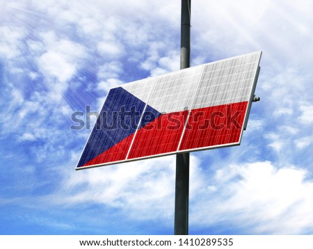 Solar panels against a blue sky with a picture of the flag of Czech Republic