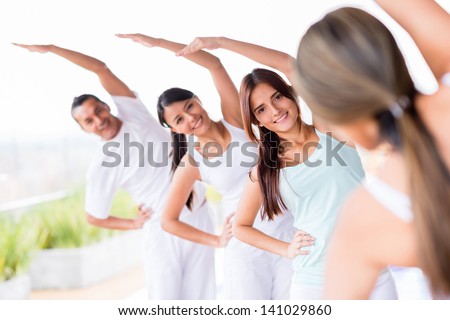 Group of people practicing yoga and stretching