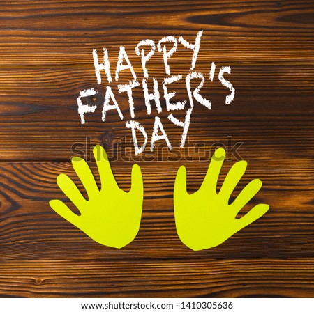 Happy fathers day sign on paper  laid on wooden floor backround. - Image 