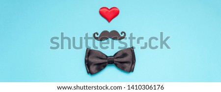Creative flatlay overhead top view retro stylish black paper moustaches bow tie red heart turquoise background copy space. Men health awareness month fathers day masculinity concept long wide banner Royalty-Free Stock Photo #1410306176