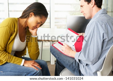 Woman Having Counselling Session Royalty-Free Stock Photo #141031024