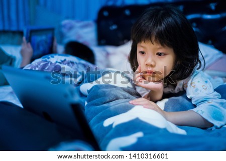 chinese child addicted phone, asian girl playing smartphone, kid use telephone, watching smartphone, watching cartoon
