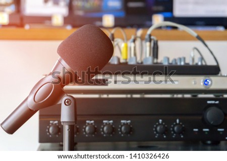 Close up of microphone on sound mixer background.