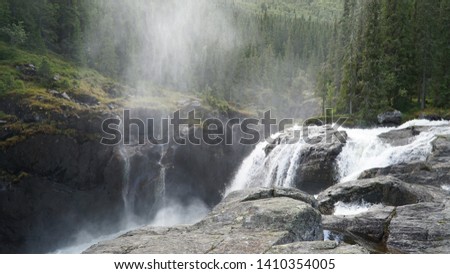 Rjukan Falls aka Rjukanfossen waterfall located in the forest near Rjukan, Norway.