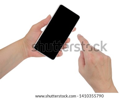 Closeup shot of a woman typing on mobile phone isolated on white background.. Girl's hand holding a modern smartphone and pointing with figer. Blank screen to put it on your own webpage or message
