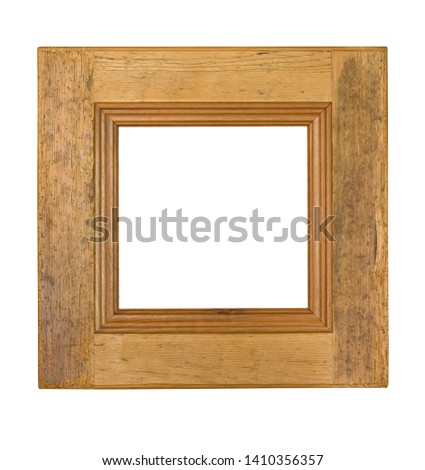 The vintage wooden picture frame with wormholes