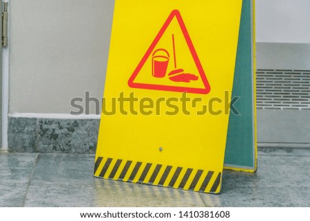 yellow warning sign "cleaning" close-up