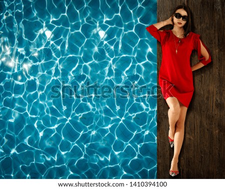 Slim young woman in summer dress and aerial photo of swimming pool 