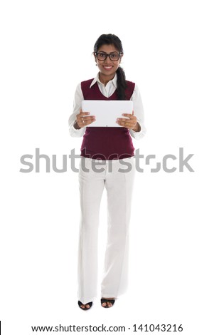 indian casual business woman with generic looking tablet, full body