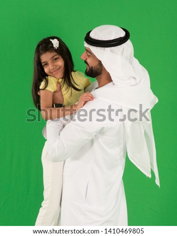 arab father playing with daughter Royalty-Free Stock Photo #1410469805