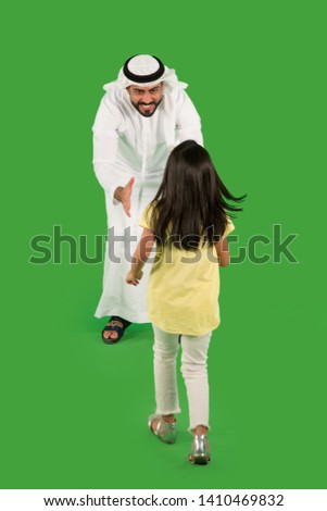 arab father playing with daughter Royalty-Free Stock Photo #1410469832