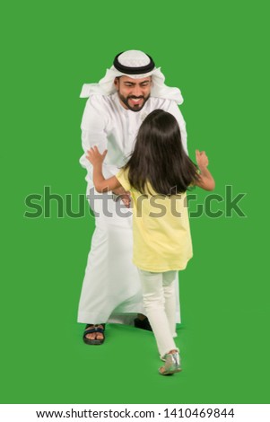 arab father playing with daughter Royalty-Free Stock Photo #1410469844