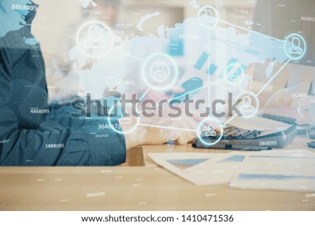 Social network theme hologram with businessman working on computer on background. Multi exposure.