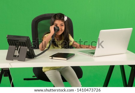 Young arab girl using telephone Royalty-Free Stock Photo #1410473726