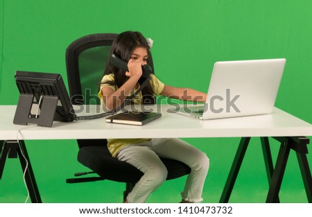 Young arab girl using telephone Royalty-Free Stock Photo #1410473732