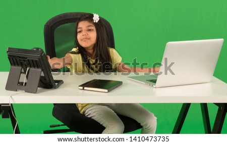 Young arab girl using telephone Royalty-Free Stock Photo #1410473735