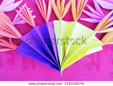 Color paper background. Decorative paper flowers
