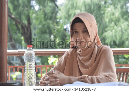 Women wearing hijab scarf study hard