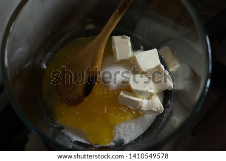 Making batter in the pot on simmerng water for russian honey cake Royalty-Free Stock Photo #1410549578