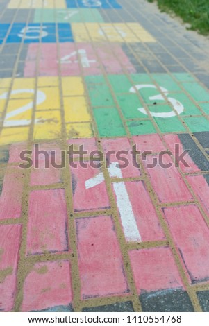 Colorful children game hopscotch on pavement